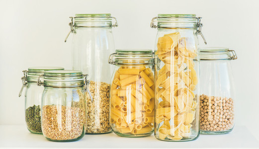 Uncooked cereals  grains  beans and pasta in jars