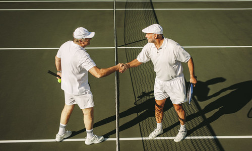 Tennis players greeting each other after a game of tennis