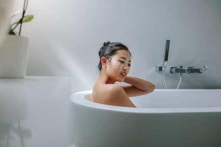 Young asian woman in bathtub