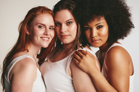 Women of different size in white tank top