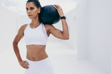 Fitness woman training with a medicine ball