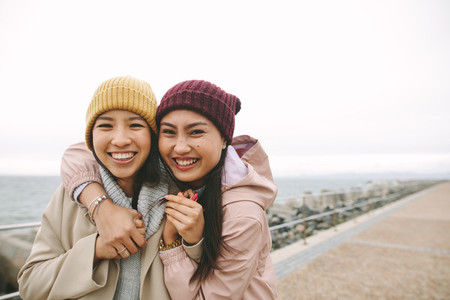 Two asian women having fun outdoors