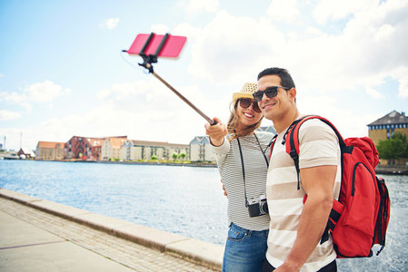 Happy young tourists posing for a selfie