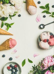 Flat lay of ice cream scoops and peonies  vertical composition