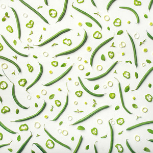 Flat lay of fresh green beans over white background square crop