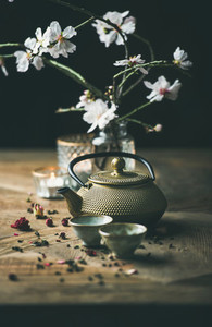 Traditional Asian tea ceremony arrangement over wooden background