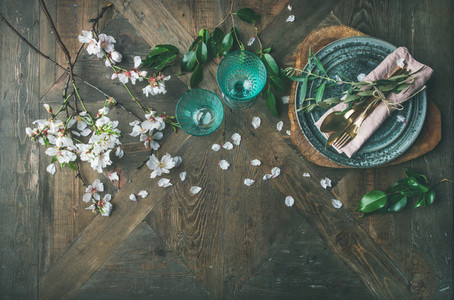Flat lay of Spring Easter Table setting with almond blossom flowers