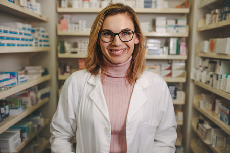 Confident female pharmacist on drug store