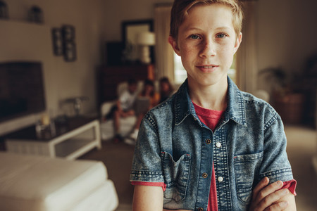 Close up of a boy standing at home