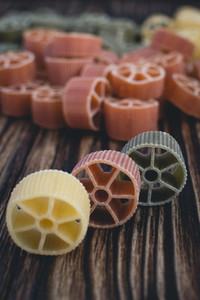 Wheel pasta detail on a wooden
