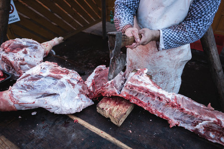 Cutting pork ribs with an axe