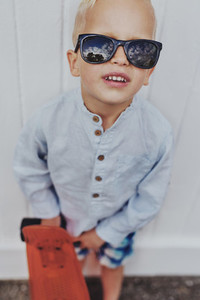 Fun little boy in trendy sunglasses