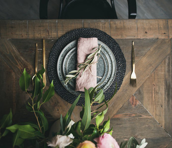 Flat lay of Spring Easter Table setting over vintage wooden background