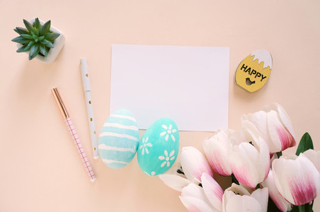 Happy Easter concept with blank card and colorful easter eggs an