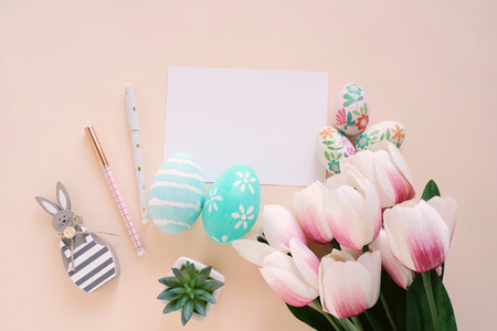 Happy Easter concept with blank card and colorful easter eggs an
