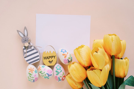 Happy Easter concept with blank card wooden bunny colorful eas
