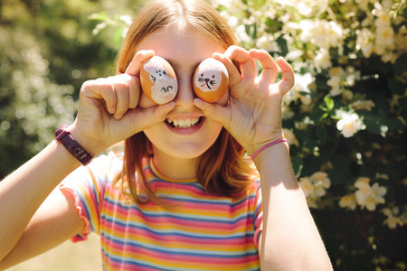 Close up of a girl holding easter eggs