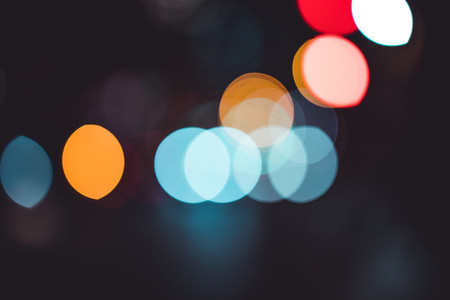 Abstract bokeh lights in city blurred night background