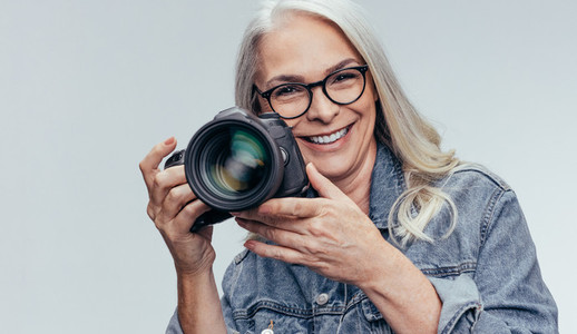 Senior photographer with a DSLR camera