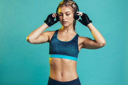 Muscular female with headphones