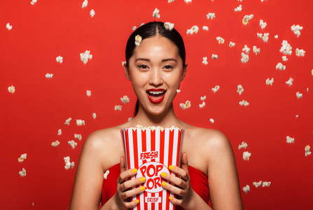 Woman enjoying a movie with popcorn