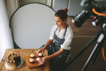 Feamle baker making a video blog