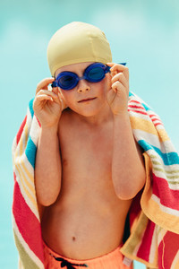 Boy drying off after swimming lessons