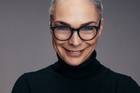 Positive senior woman with eyeglasses