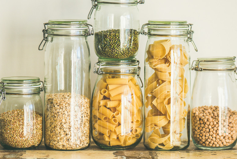 Uncooked cereals, grains, beans and pasta on table, square crop