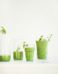 Matcha green smoothie with chia seeds in glasses copy space