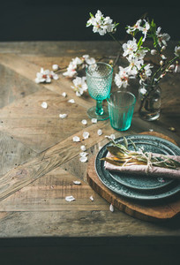 Spring Easter holiday Table setting over vintage wooden background