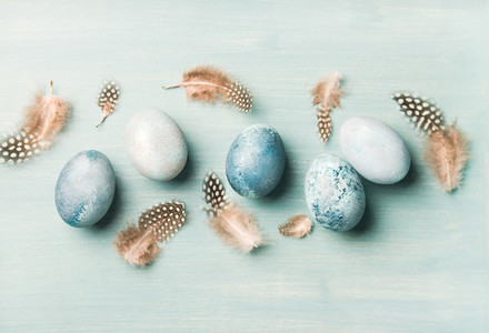 Painted eggs for Easter over light blue background  horizontal composition