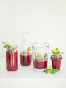 Fresh beetroot smoothie or juice in glasses with mint