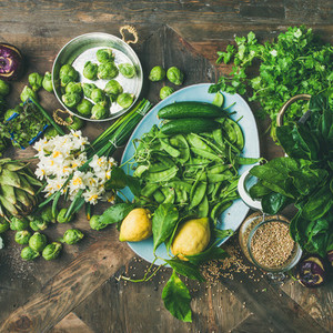 Spring healthy vegan food cooking ingredients wooden background square crop
