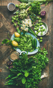 Spring healthy vegan food cooking ingredients  wooden background  vertical composition