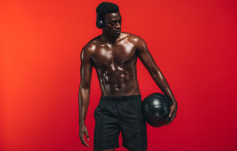 Fit young man with medicine ball