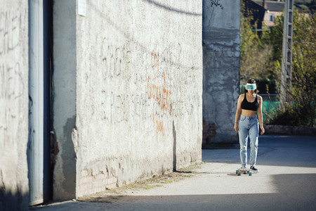 Girl with her skate on a town road
