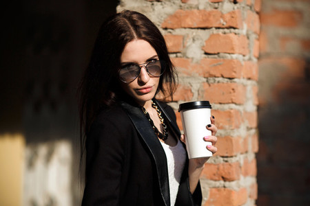 Beautiful girl in glasses with coffee