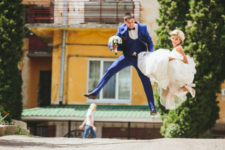 couple jumping on the street