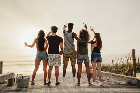 Group of friends having party at the beach