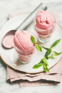 Homemade strawberry yogurt ice cream in glasses