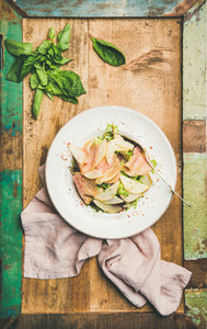Fresh summer salad with smoked turkey ham and pear