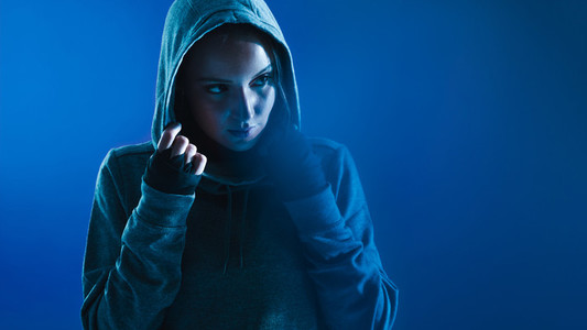 Fitness woman in hooded shirt
