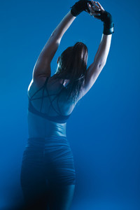 Woman stretching in sportswear