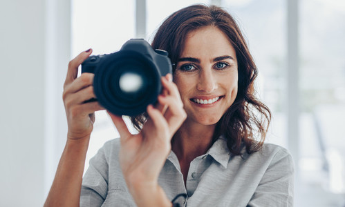 Smiling female photographer