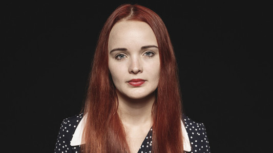 Caucasian woman with reddish brown hair