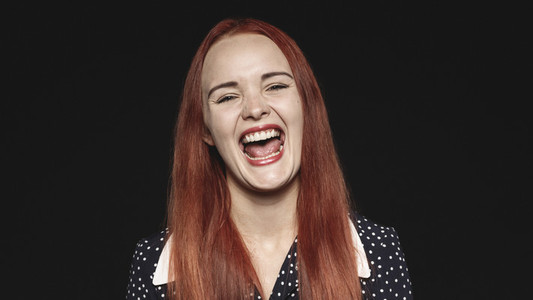Portrait of young woman laughing
