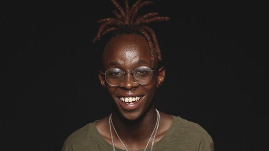 Portrait of smiling african man with dreadlocks