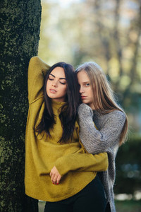 Two girls posing in the park