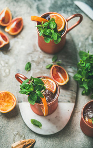 Blood orange Moscow mule alcohol cocktails in metal mugs
